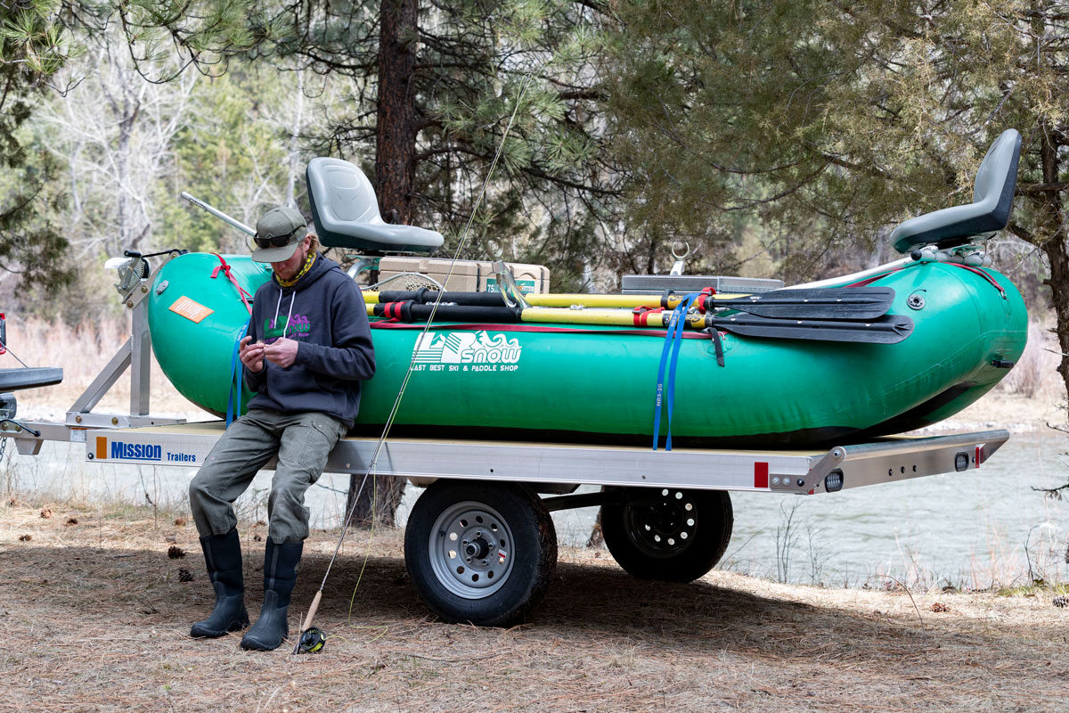 An angler tying flies getting ready to float fish in Montana