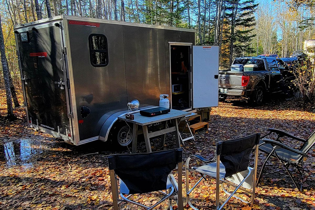 A custom built-out ALCOM aluminum trailer set up for camping in the New England woods; photo courtesy of Ted McLaughlin