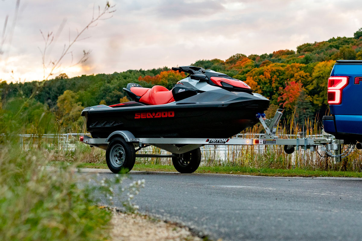 Triton aluminum LT Series PWC trailer hitched to a truck with one PWC