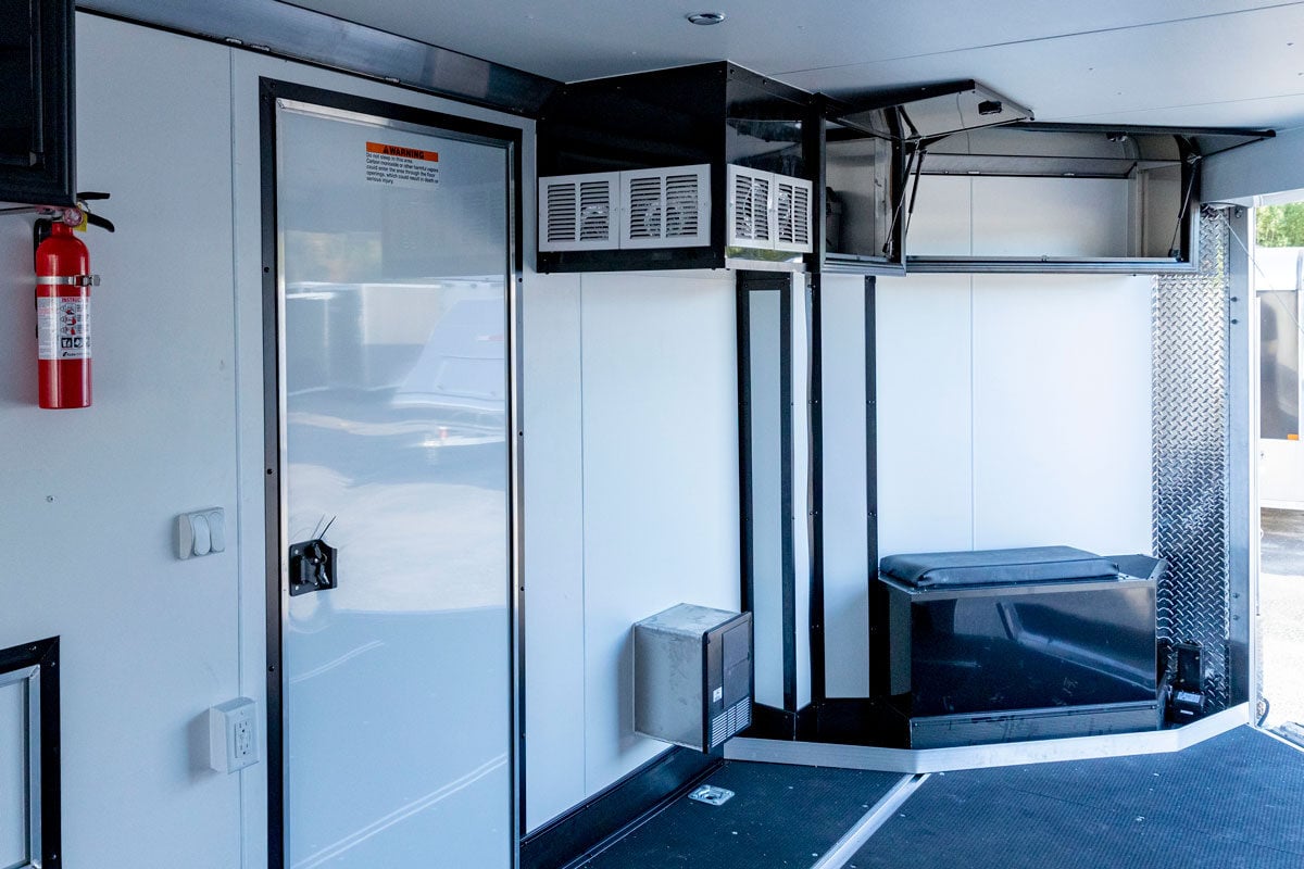 Heater, cabinets, and accessories inside an All Sport Elevation trailer