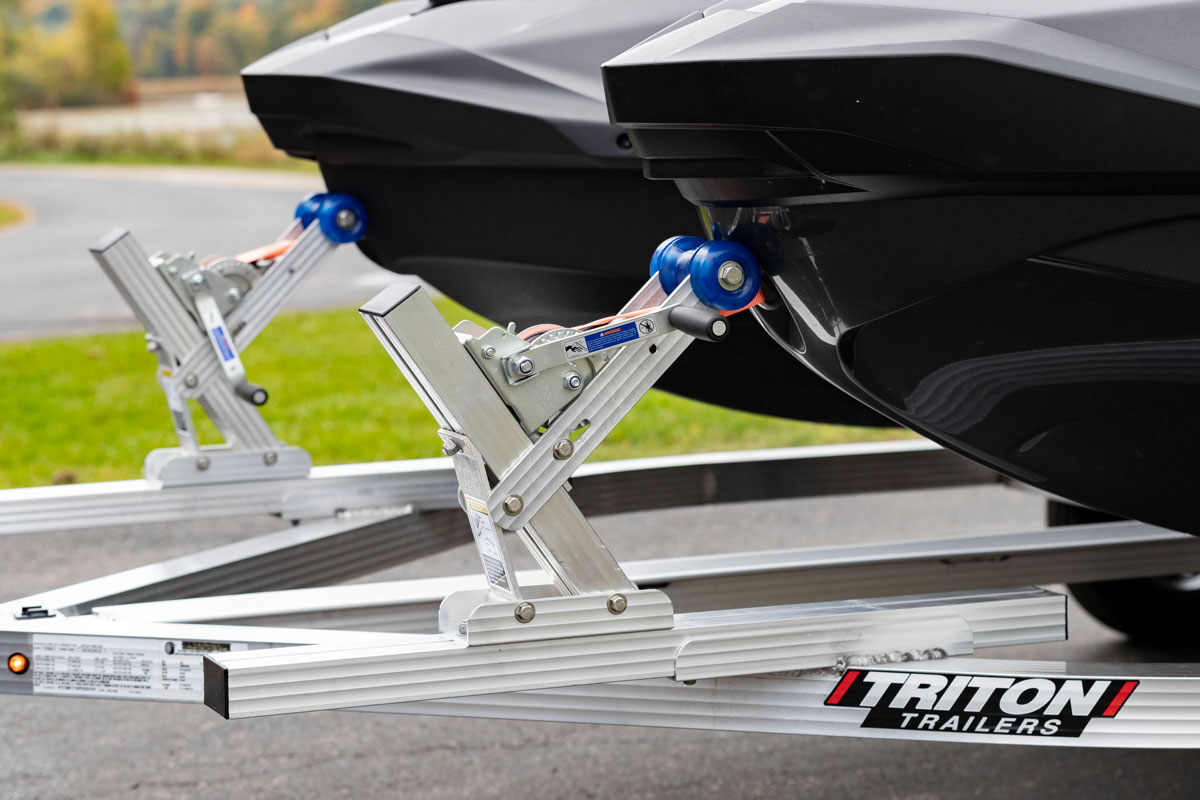 Close up view of infinite slide adjustable (ISA) bow stops on a Triton aluminum PWC trailer